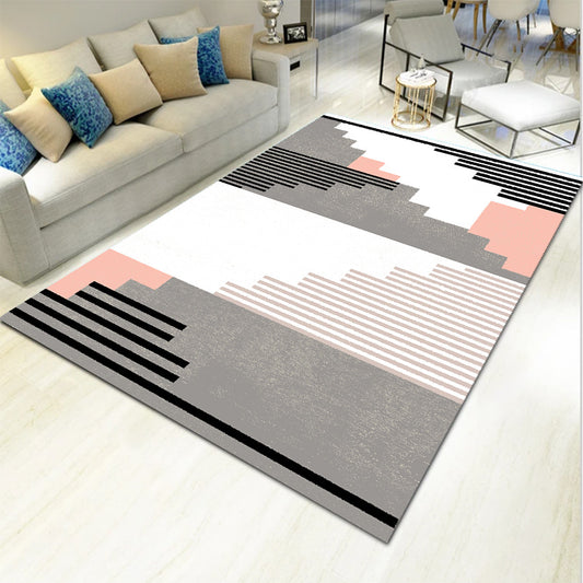 Several light geometric carpet mats